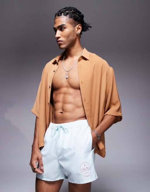ASOS DESIGN - Pantaloncini da bagno taglio corto blu e bianchi a righe