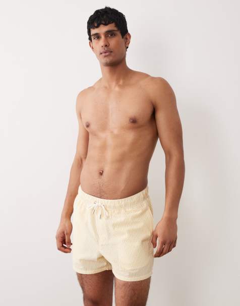 ASOS DESIGN - Pantaloncini da bagno taglio corto gialli a righe in tessuto seersucker - view 1