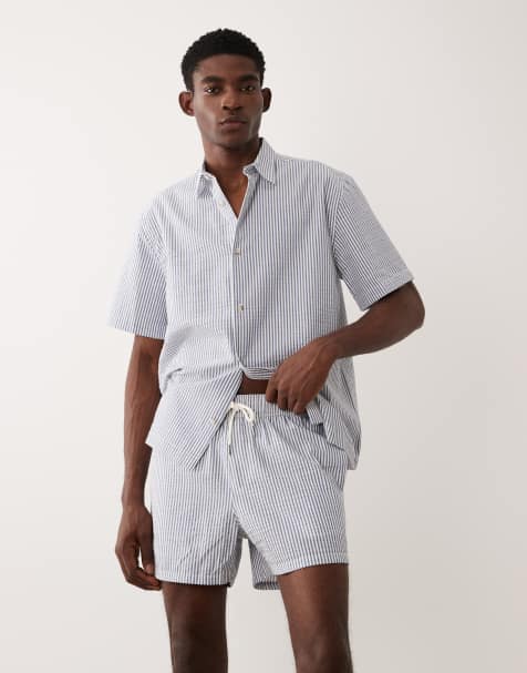 ASOS DESIGN - Pantaloncini da bagno taglio corto in tessuto seersucker blu navy a righe in coordinato - view 1