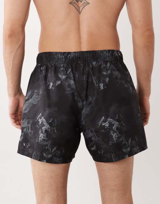 ASOS DESIGN - Pantaloncini da bagno taglio corto neri con stampa cherubino, 5 di 5