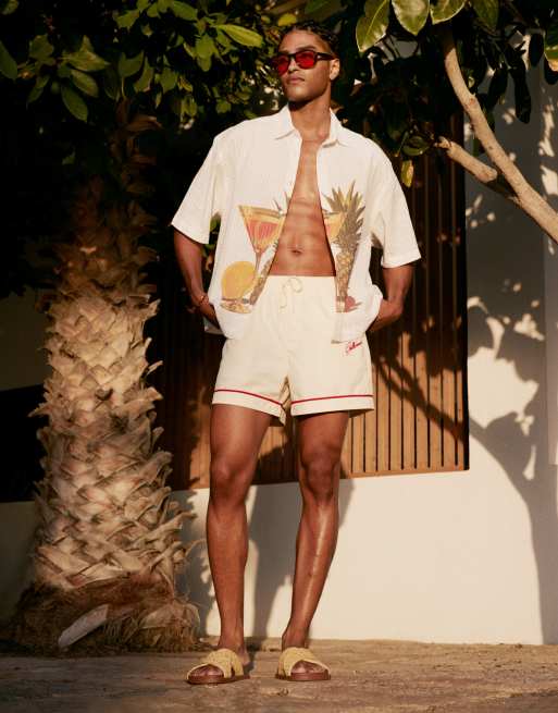 ASOS DESIGN - Pantaloncini da bagno taglio corto neutro con logo ricamato