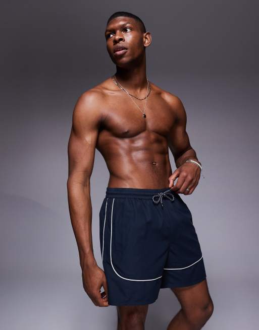 ASOS DESIGN - Pantaloncini da bagno taglio medio blu navy con profili bianchi a contrasto