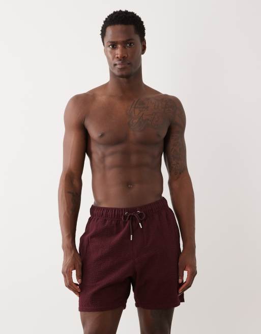 ASOS DESIGN - Pantaloncini da bagno taglio medio in seersucker bordeaux