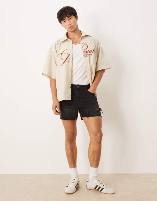ASOS DESIGN - Pantaloncini di jeans dritti taglio corto lavaggio nero con strappi