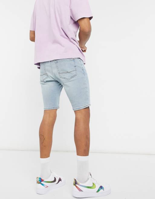 ASOS DESIGN - Pantaloncini di jeans skinny lunghezza normale lavaggio blu chiaro vintage tinto, 2 di 4
