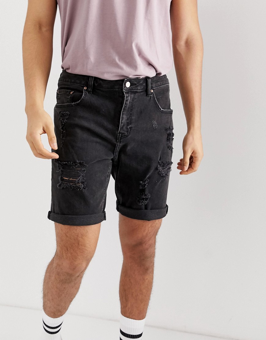 ASOS DESIGN - Pantaloncini di jeans slim nero slavato con strappi vistosi