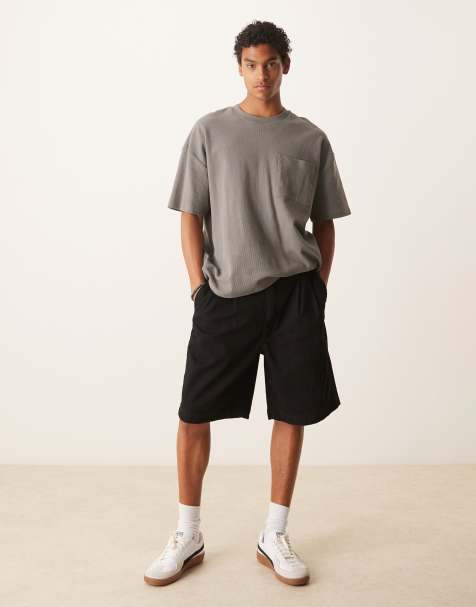 ASOS DESIGN - Pantaloncini di jeans taglio medio lavaggio nero con pieghe - view 1