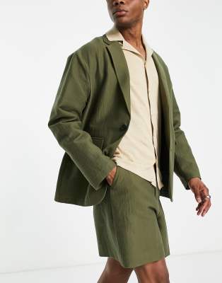 ASOS DESIGN - Pantaloncini kaki a fondo ampio verdi stropicciati