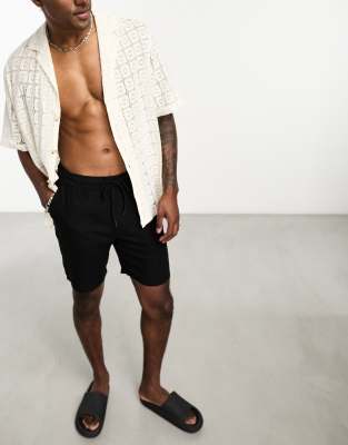 ASOS DESIGN - Pantaloncini neri slim taglio medio