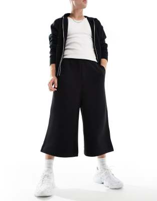 ASOS DESIGN - Pantaloncini neri taglio super lungo