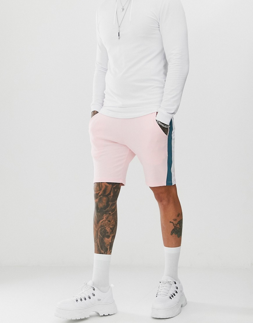 ASOS DESIGN - Pantaloncini skinny in jersey rosa con righe laterali