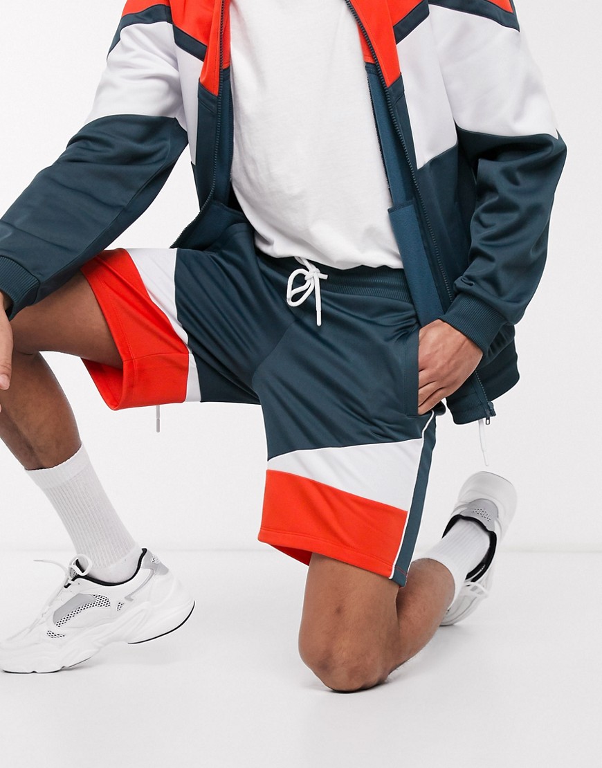 ASOS DESIGN - Pantaloncini skinny in tricot di poliestere color block in coordinato-Navy