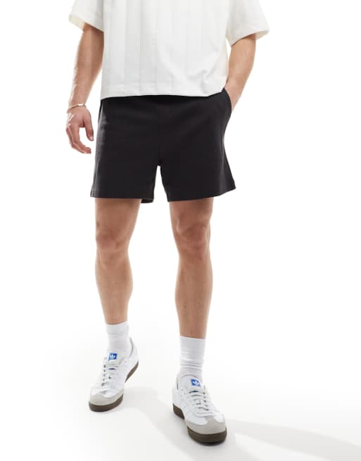 ASOS DESIGN - Pantaloncini slim neri a nido d'ape 
