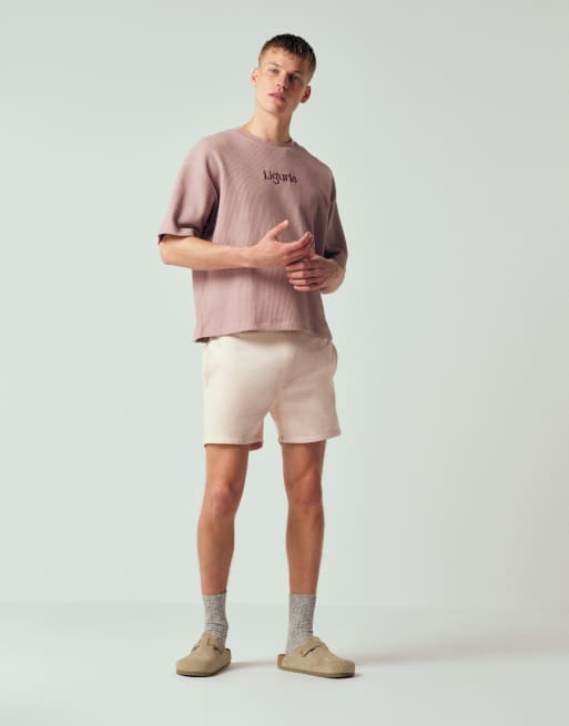 ASOS DESIGN - Pantaloncini slim taglio corto in jersey rosa slavato