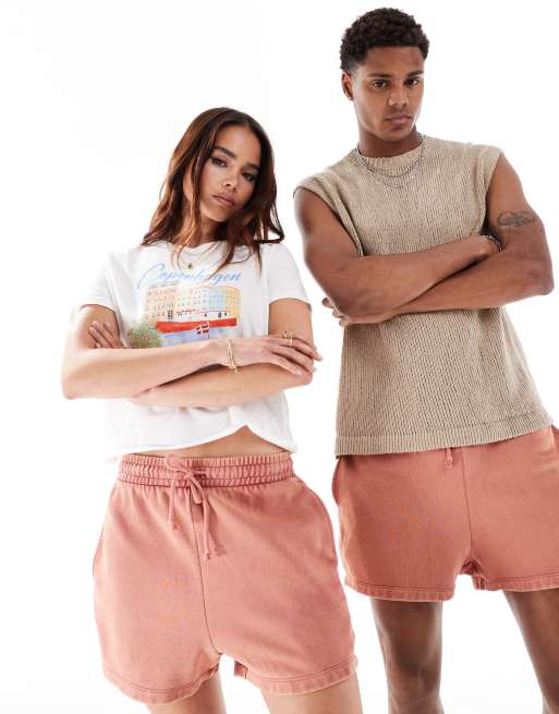 ASOS DESIGN - Pantaloncini slim unisex taglio corto rosa slavato