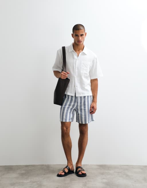 ASOS DESIGN - Pantaloncini taglio medio ampi in misto lino a righe in coordinato