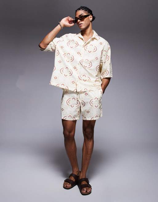 ASOS DESIGN - Pantaloncini taglio medio beige con stampa geometrica in coordinato