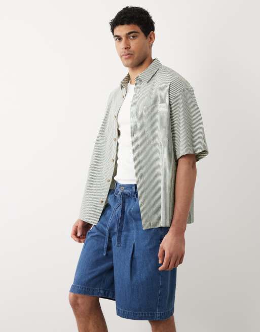 ASOS DESIGN - Pantalones cortos vaqueros azules de corte alargado suelto con lavado medio y cinturón, 3 de 5