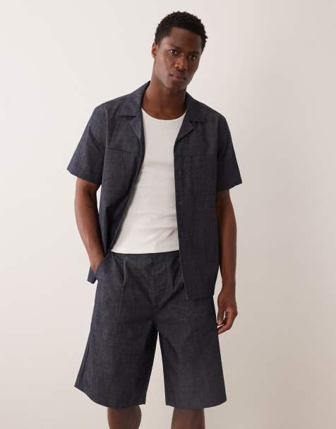 ASOS DESIGN - Pantalones cortos vaqueros ligeros de corte alargado suelto con lavado azul crudo y pinzas - view 1
