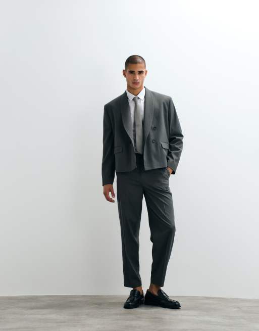 ASOS DESIGN - Traje gris de corte tapered extragrande con patrón de espiga, 2 de 3