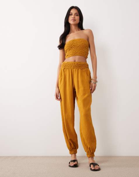 ASOS DESIGN - Pantalones dorados con cintura abombada fruncida de bambula - view 1
