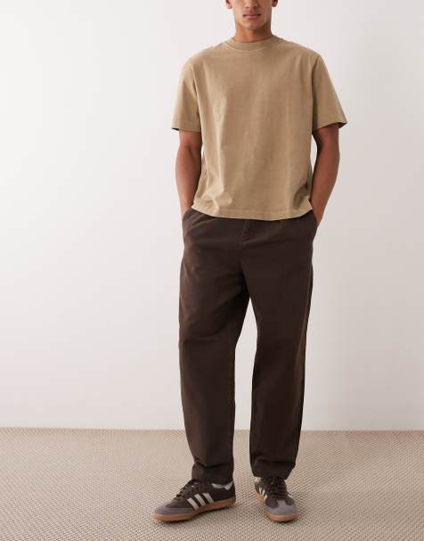 ASOS DESIGN - Pantalones marrones de corte tapered holgado con pinzas invertidas - view 1