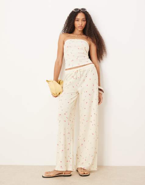 ASOS DESIGN - Pantaloni a fondo ampio color limone con stampa a fiorellini in tessuto a nido d'ape in coordinato - view 1