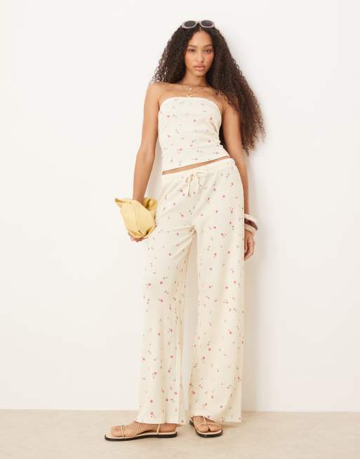 ASOS DESIGN - Pantaloni a fondo ampio color limone con stampa a fiorellini in tessuto a nido d'ape in coordinato