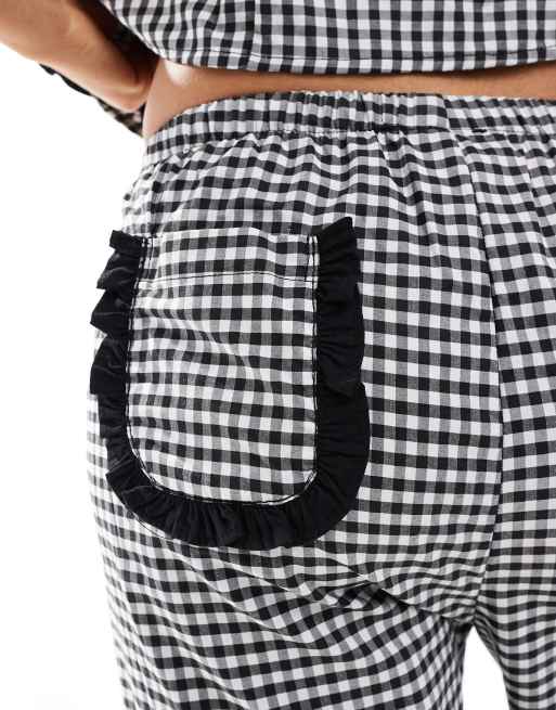 ASOS DESIGN - Pantaloni a fondo ampio neri a quadretti con tasche con volant, 4 di 5