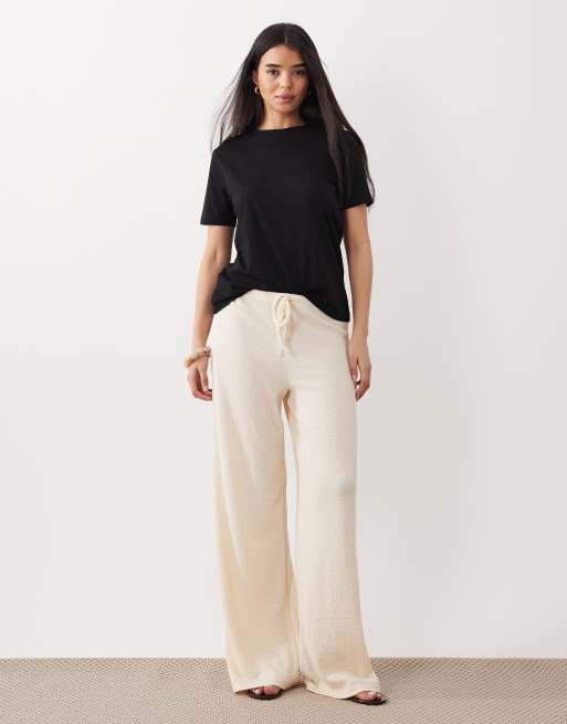 ASOS DESIGN - Pantaloni a fondo ampio testurizzati color crema in coordinato