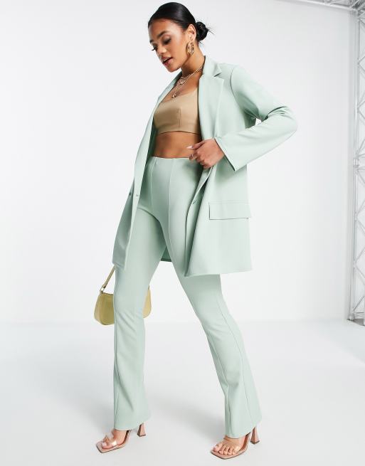 ASOS DESIGN - Pantaloni a zampa a vita bassa da abito in jersey color salvia
