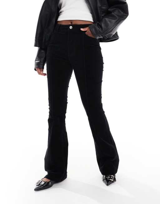 ASOS DESIGN - Pantaloni a zampa con cuciture in tessuto a coste nero taglio grezzo 