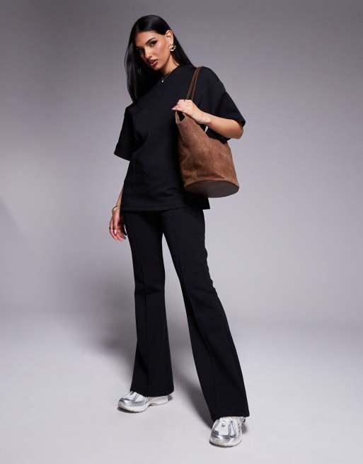 ASOS DESIGN - Pantaloni a zampa skinny in interlock neri con cuciture in coordinato