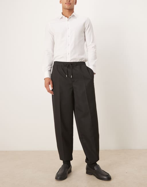 ASOS DESIGN - Pantaloni affusolati neri con fascia in vita e fondo elasticizzati, 2 di 5