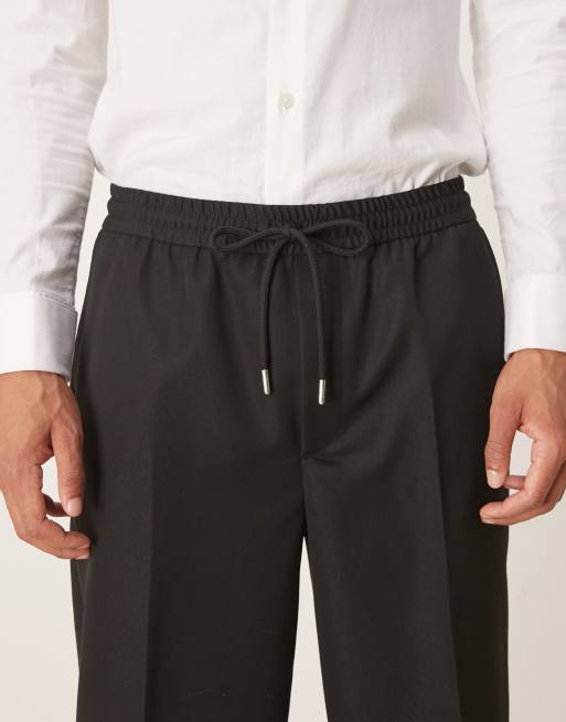 ASOS DESIGN - Pantaloni affusolati neri con fascia in vita e fondo elasticizzati, 4 di 5