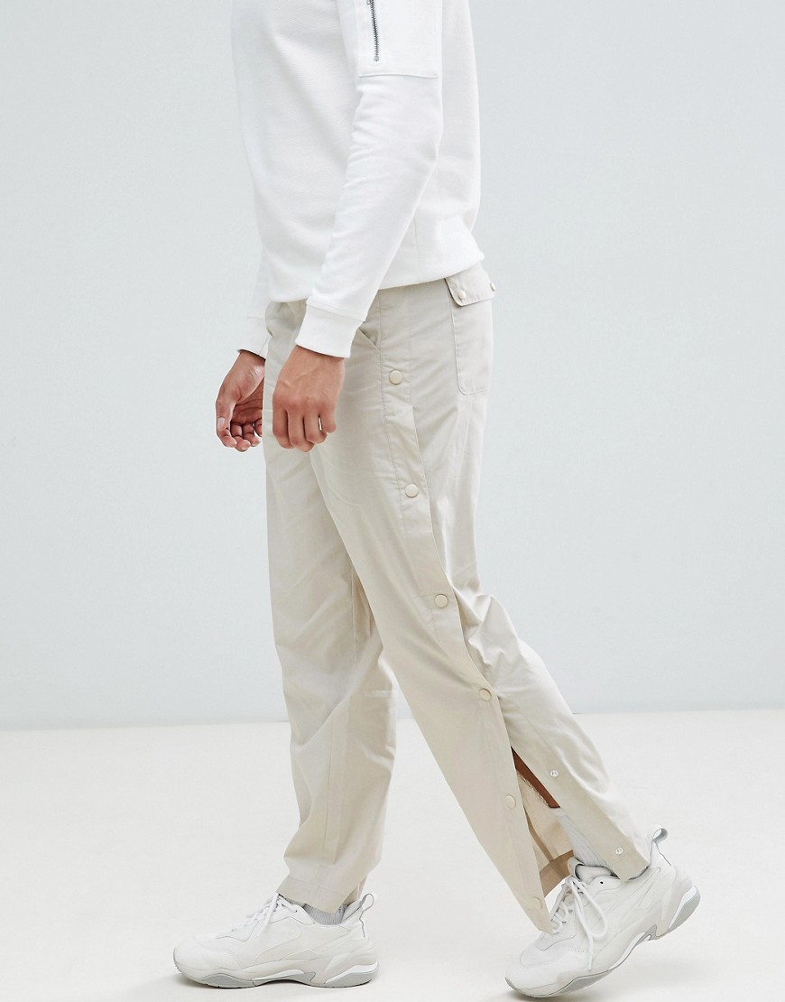 ASOS DESIGN - Pantaloni comodi beige con bottoni a pressione laterali