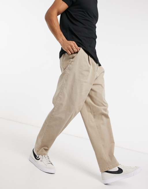 ASOS DESIGN - Pantaloni con fondo ampio e pieghe color pietra slavato