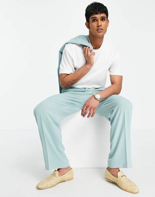 ASOS DESIGN - Pantaloni da abito morbidi a fondo ampio con taglio sartoriale in crêpe verde pastello