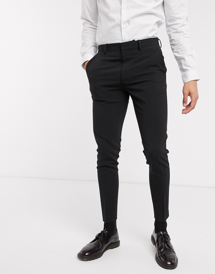 ASOS DESIGN - Pantaloni da abito super skinny neri elasticizzati in quattro direzioni-Nero