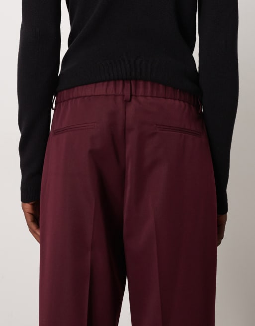 ASOS DESIGN - Pantaloni eleganti oversize affusolati con pieghe ed elastico in vita bordeaux, 4 di 5