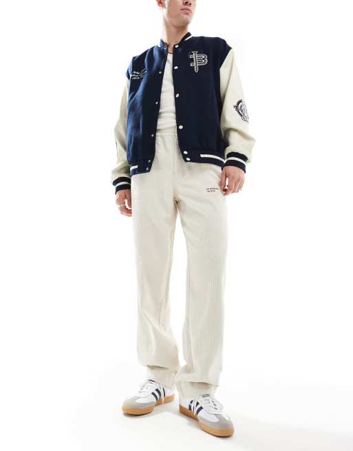 ASOS DESIGN - Pantaloni extra ampi in velluto a coste color pietra con toppa ricamata 