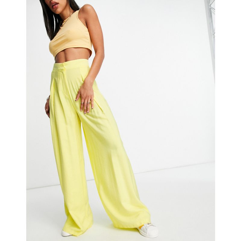 Donna Pantaloni con fondo ampio DESIGN - Pantaloni fluttuanti a fondo ampio gialli