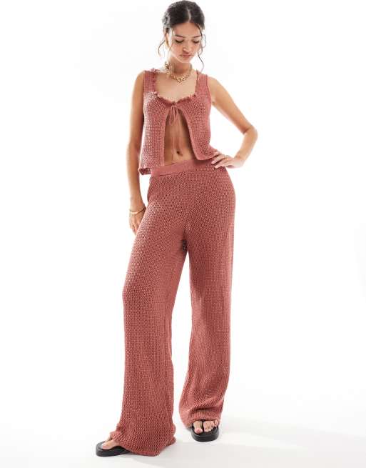 ASOS DESIGN - Pantaloni in maglia color ruggine a fondo ampio in coordinato