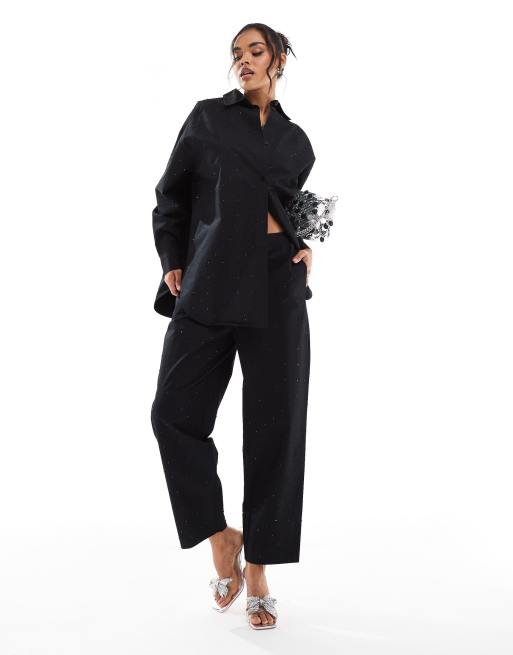 ASOS DESIGN - Pantaloni neri con dettagli applicati a caldo in coordinato
