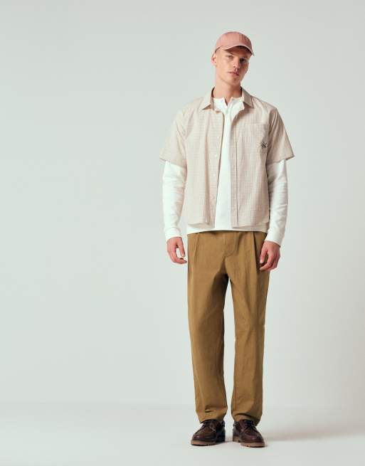 ASOS DESIGN - Pantaloni oversize affusolati con pieghe in tessuto tecnico color cuoio