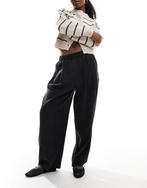 ASOS DESIGN - Pantaloni premium color nero slavato con dettaglio a pieghe