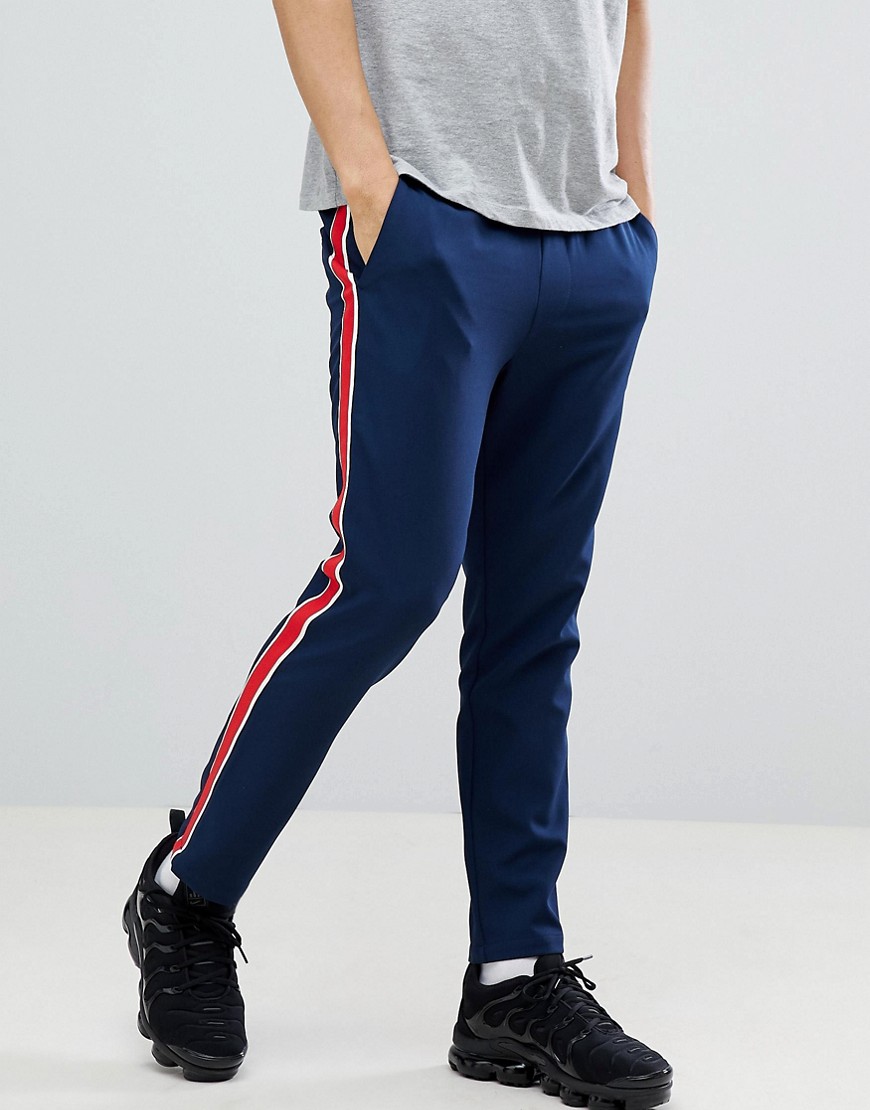 ASOS DESIGN - Pantaloni slim alla caviglia blu navy con riga rossa laterale