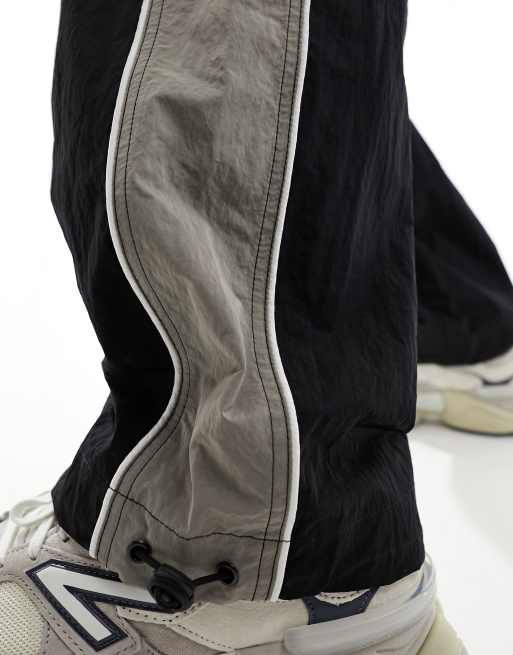 ASOS DESIGN - Pantaloni sportivi ampi in nylon neri con riga laterale grigia , 2 di 5