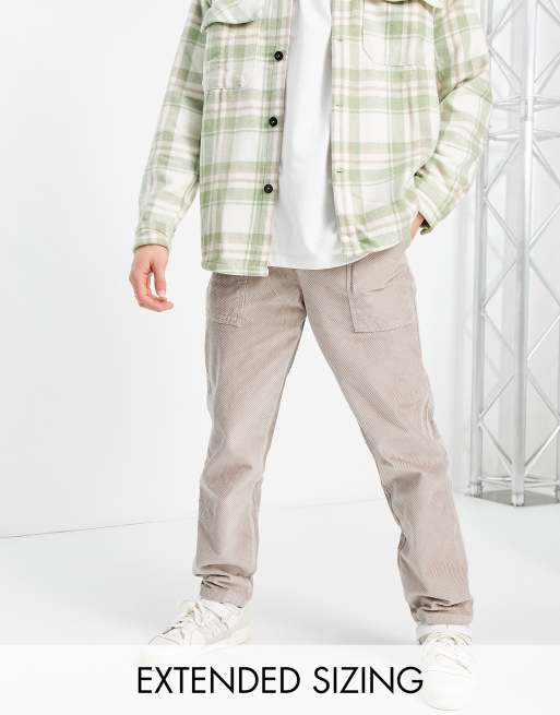 ASOS DESIGN - Pantaloni stile skater a coste con taglio sbieco beige