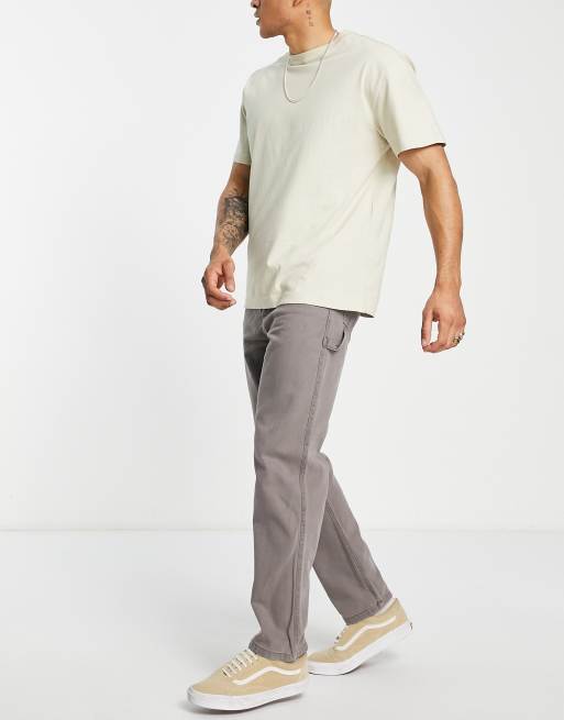ASOS DESIGN - Pantaloni stile skater in twill slavato con tasche